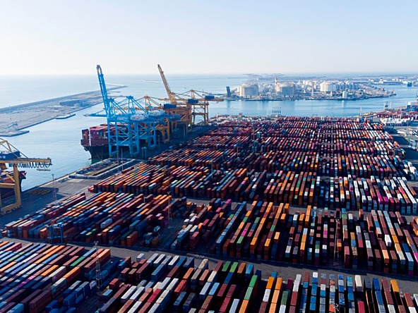 shipping containers and cargo ships at the port of barcelona